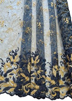 an embroidered lace with gold and black flowers on white, blue and yellow colors is shown