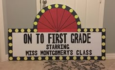 a sign that says on to first grade starting miss montgomery's class