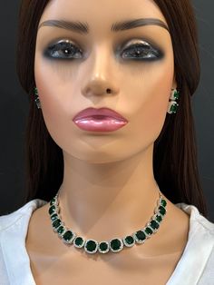 Emerald CZ diamond Necklace, Indian Pakistani wedding Jewelry, Mother of the Bride, Crystal Necklace, Bridesmaid, Gift for her  Gorgeous Emerald CZ Set in aaa quality CZ stones. This American Diamond Necklace Set comes with a pair of earrings. Necklace length 16 inches and shortened to 15 inches  Earrings Length approx 1 inch Regular size and adjustable Arrives in a gift box. Highest quality and craftsmanship Ready to ship from California, United States and delivery in 3-5 days in US Please let me know if you have any questions. Thank you so much for visiting my shop. Color, shades, and texture displayed may slightly vary from the actual product due to digital image limitations. We request you to consider these minor variations. Please expect the possibility of some slight imperfections wh Green Sparkling Stones Jewelry Sets For Wedding, Elegant Green Rhinestone Jewelry Sets, Elegant Green Jewelry Sets With Rhinestones, Elegant Green Rhinestone Necklace For Wedding, Green Crystal Rhinestone Necklace For Wedding, Crystal Bridal Sets With Rhinestones As Gift, Emerald Jewel Bridal Necklace For Wedding, Green Crystal Rhinestone Necklace For Formal Occasions, Green Rhinestone Necklace For Formal Occasions