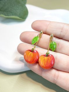 Handmade small apple earrings, 100% hand-drawn and handcrafted in Canada, unique and cute style, combined with hypoallergenic 18k gold plated earrings. Perfect for gifts.  🍎 Main Material: Colored Pencil, Shrink Plastic, UV Resin, 18k gold plated earrings.  🍎 Designed and made in Vancouver, Canada. 🍎 Please be aware that this is a handmade item. Its pattern has a certain randomness, and there is no guarantee that each piece is 100% the same. 🍎 For customers out of Canada: please message me y Apple Earrings, Whimsical Jewelry, Fruit Jewelry, Shrink Plastic, Craft Art, Earring Crafts, Vancouver Canada