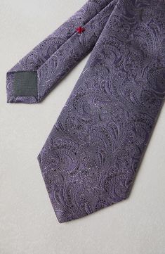 A timeless accessory, this elegant necktie is perfect for completing looks with a personal touch. Length approx. 59.06" Luxury Tie For Gift, Luxury Standard Tie For Gift, Luxury Gift Tie, Luxury Business Suit And Tie Accessories, Elegant Standard Ties For Business, Elegant Silk Mark Certified Suit And Tie Accessories, Classic Purple Neckwear For Formal Occasions, Luxury Standard Tie For Formal Occasions, Elegant Standard Tie For Semi-formal Occasion