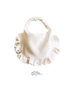 a white bib with ruffles on it