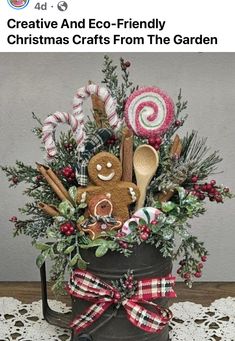 an image of a christmas arrangement in a bucket with candy canes and candies