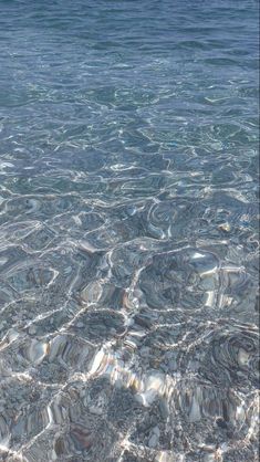 the water is very clear and blue with little ripples on it's surface