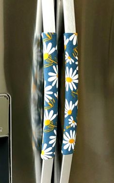 a close up of a refrigerator door with flowers on it