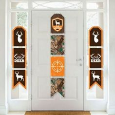 the door is decorated with hunting themed banners and deer head decals on it's side