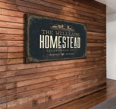 a wooden wall with a sign that reads the williams homestead