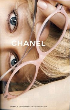 a woman with glasses on her face and the words chanel in front of her