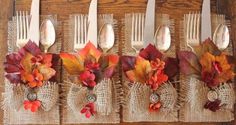 the forks are decorated with fall leaves and burlap