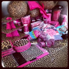 the table is covered with pink and leopard print items