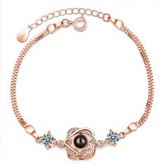 Bring a touch of elegance to your ensembles with this gorgeous rose gold-plated bracelet featuring a heart charm. Bracelet: 6.3" L with 1.38" extender Charm: 0.47" diameter Spring ring clasp 18k rose gold-plated copper / cubic zirconia / glass Elegant Rose Gold Heart Metal Bracelet, Elegant Rose Gold Bracelets For Mother's Day, Elegant Metal Charm Bracelet For Mother's Day, Elegant Rose Gold Charm Bracelet For Gifts, Rose Gold Round Bracelet For Mother's Day, Rose Gold Cubic Zirconia Charm Bracelet Gift, Mother's Day Rose Gold Round Bracelet, Valentine's Day Rose Gold Metal Charm Bracelet, Valentine's Day Adjustable Rose Gold Charm Bracelet