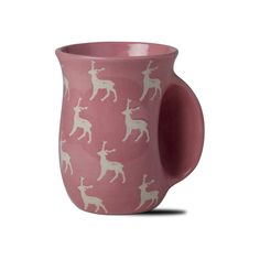 a pink cup with white deer on it