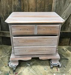 an old wooden dresser with wheels on it