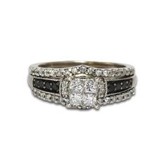 a white gold ring with black and white diamonds