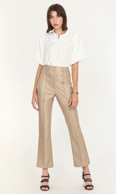 Nothing is classier than these vegan leather pants. The high waist and slight flare help elongate the legs while the pintuck down the center of the legs help the garment look clean and crisp. The interior of the piece is lined with a soft, polyester fabric. Cream Leather Pants Outfit, Cream Leather Pants, Women's Leather Pants, Leather Pants For Women, Vegan Leather Pants, Leather Pants Women, Luxury Wear, Leather Pant, Luxury Women Fashion