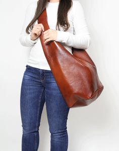 "LEATHER HOBO BAG - leather BOHO bag This hobo is the perfect size to carry your daily essentials in style! It is made from high quality leather. This bag is perfect as your everyday bag, which can fit an IPAD, A4 files, books, magazines, cosmetic bag as well as many accessories. DIMENSIONS: * height of bag with strap: 31,5\" (80 cm) * height without strap: 11.8\" (30 cm) * width at the top: 21.3\" (54 cm) * rectangle shaped bottom: 11.5\" x 9,5 (24 cm x 29 cm) * Internal pockets for mobile phon Leather Slouch Bag, Boho Leather Bags, Slouchy Hobo Bag, Leather Hobo Bags, Leather Work Bag, Slouchy Bag, Large Leather Bag, Boho Handbags, Slouch Bags