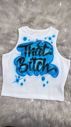 Designs by Galveston Airbrush! ♡ Feel free to contact me with any questions or custom orders. ✧ Our Designs on these cute Crop tops are handmade with the artists' skilled Hands and that makes each item unique ✧ Each design includes up to TWO names or words with up to THREE specified COLORS. SIZES: Available for ADULTS DESIGN PLACEMENT: All designs are airbrushed on the FRONT of the crop top unless specified otherwise. International orders will have an additional shipping charge. WASHING INSTRUCT Airbrush Crop Top, Trendy Screen Print Tank Top For Streetwear, Blue Cotton Tops With Graffiti Print, Trendy Graffiti Print Summer Tops, Casual Fitted Tops With Graffiti Print, 90s Style Graffiti Print Tops For Spring, White 90s Tank Top For Streetwear, 90s Style White Tank Top For Streetwear, 90s White Tank Top For Streetwear