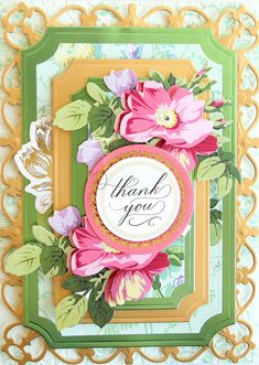 a thank card with flowers and leaves on the front, in a green frame that says thank