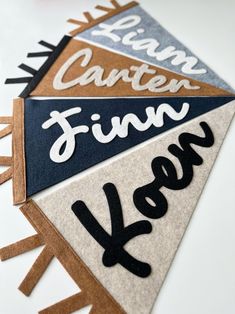 four pennants with different lettering on them