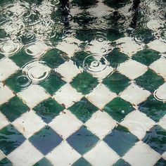 an image of a tiled floor with water