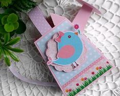 a small card with a blue bird on it