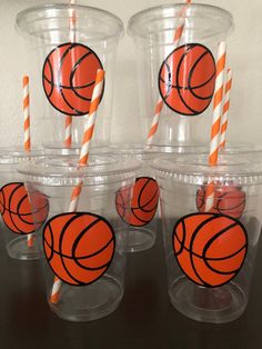 plastic cups with orange and black basketballs on them