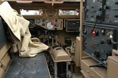 the inside of an airplane with many controls