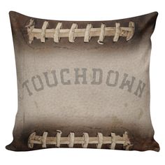 an old baseball pillow with the word touchdown on it's front and back