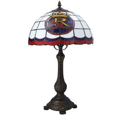 a stained glass lamp with an emblem on it