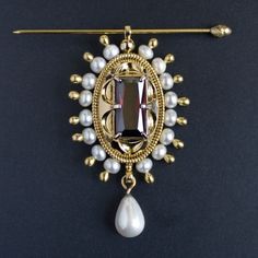 Temporarily unavailable
Burgundian brooch-pendant, made after 15th century painting. Brass cast, gold plating, natural and faux pearls, lab garnet.
Size is ~42 x 73 mm including all pearls. Brass pin with acorn head comes with the brooch. Gold Pendant Brooch For Ceremonial Use, Gold Jeweled Pendant Brooches, Gold Pendant Brooches With Jewels, Gold Pendant Brooch With Jewels, Gold Brooch With Pearl Pendant For Wedding, Gold Wedding Brooch With Pearl Pendant, Vintage Gold Brooch With Pearl Pendant, 15th Century Paintings, Medieval Accessories