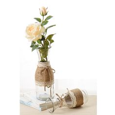 a vase filled with flowers sitting on top of a table next to a pair of scissors