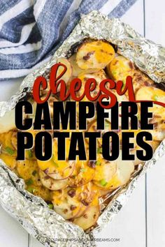 cheesy campfire potatoes in foil with text overlay