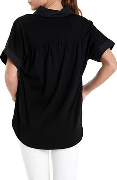 A jersey back panel adds a contrasting texture to a button-front top that's a casual yet sophisticated closet staple. Front button closure Spread collar Short sleeves 100% cotton with 68% rayon, 27% nylon, 5% spandex contrast Hand wash, dry flat Imported Layering Cotton Tops With Placket, Casual Tops With Relaxed Fit And Back Button Closure, Casual Relaxed Fit Tops With Back Button Closure, Chic Rayon Tops With Shirttail Hem, Casual Rayon Blouse For Layering, Versatile Cotton Tops With Buttons, Versatile Black Rayon Tops, Casual Rayon Tops For Layering, Relaxed Fit Tops For Layering With Placket