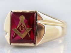 This vintage red ruby glass Masonic ring features polished, structurally simple shoulders, and a simple rectangular shape. The center is a classic red ruby glass cabochon, inlaid with the gold Masonic symbol, with a nice flat profile. Metal: 10K Yellow Gold Gem: Ruby Glass Gem Measurements: 12.0 x 10.1 mm, Rectangle Ring Size: 12.50 Marks: "10K" Stamped on the inside band Masonic Symbol, Mens Vintage Jewelry, Gem Ruby, Rectangle Ring, Masonic Symbols, Right Hand Ring, Jewelry Mens, Masonic Ring, Best Flats