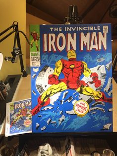 an iron man comic book is on display