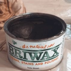 a can of brl wax sitting on top of a table