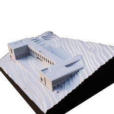 an architectural model of a building on top of snow