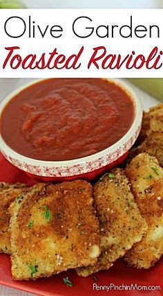 some fried ravioli on a red plate with dipping sauce