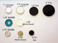 several different types of buttons are shown on a white board with black and blue accents