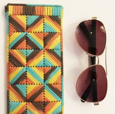 🛑🛑PLEASE BE SURE TO CHECK MEASUREMENTS OF YOUR GLASSES TO KNOW THAT THEY WILL FIT BEFORE ORDERING🛑🛑 These lightweight geometric inspired glasses cases are great for reading glasses or sunglasses. Padded yarn is stitched onto plastic canvas and a metal flex frame is used as a closure. To give you an idea on size, the rough measurements of the sunglasses used in these photos are 5.5in x 2in x 1in. This listing is for a single case.  The sunglasses are not included. Please choose which style in Glasses Cases, Geometric Inspiration, Eye Wear Glasses, Glasses Case, Nova Scotia, Plastic Canvas, Reading Glasses, Color Combinations, Round Sunglasses