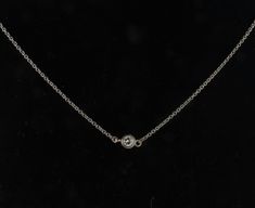 14kt White Gold Bezel Set Diamond Solitaire Necklace made to order. This delicate minimalist necklace can be worn everyday alone or with others for a layered look. Available in White, Rose or Yellow 14kt gold with a diamond of HI color and clarity SI. Available in .03ct to .50ct The necklace comes in 16, 18, 20 inches in length. Please note there is a 7-10 day wait until the necklace is delivered due to being made to order. Solitaire Necklace Diamond, Delicate Diamond Necklace, Diamond Necklace Gift, Cable Jewelry, Diamond Star Necklace, Floating Diamond Necklace, Minimalist Necklace Gold, Floating Necklace, Solitaire Necklace