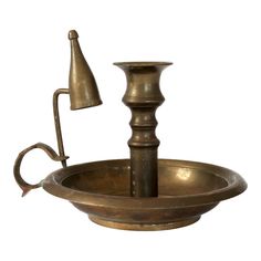 an antique brass water fountain with two faucets on the sides and a lamp in the middle