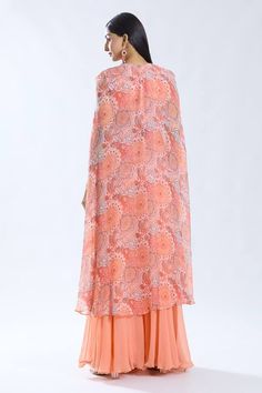 Peach asymmetric cape with floral pattern. Paired with a thread and tassel embroidered short inner kurta and sharara. - Aza Fashions Asymmetric Cape, Kurta And Sharara, Kurta Set For Women, Embroidered Shorts, Kurta Set, Set For Women, Aza Fashion, Fashion Set, Floral Pattern