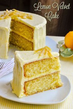 a slice of lemon velvet cake on a plate next to the rest of the cake