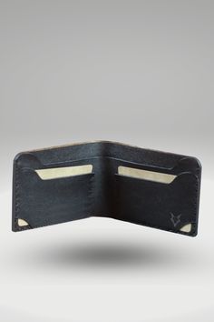 Men's Glossy Black Genuine Cowhide Leather Wallet With Crocodile Textured Finish | Bifold Hand-Made Leather Wallet Our bifold hand-made men's crocodile leather wallet is a refined, high-quality leather wallet that boasts a glossy finish and 3D crocodile texture. Made using 100% vegetable-tanned cowhide leather, this wallet has an elegant design with the perfect balance between style and functionality. The wallet's major feature is its full-length inner shell which provides even more space for cards and cash without compromising on quality or durability. Style: Standard Bi-Fold Wallet Made: Hand-stitched using waxed polyamide thread Leather: 100% Vegetable Tanned Cowhide leather With 3D Crocodile Textured Finish OuterShell Color: Black InnerShell Color: Black Thread: Black Closure: Bi-fold Black Leather Wallet For Daily Use, Black Leather Rectangular Wallet, Black Bifold Wallet With Interior Card Slots, Business Leather Card Holder With Crocodile Pattern, Leather Bifold Card Holder With Crocodile Pattern, Black Leather Wallet With Crocodile Pattern, Black Leather Wallets With Crocodile Pattern, Black Leather Wallet With Rfid Blocking, Black Leather Trifold Wallet For Business