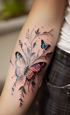 a woman with a butterfly tattoo on her arm