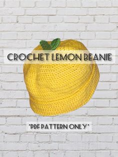 a crochet lemon beanie is shown against a white brick wall with the words crochet lemon beanie on it