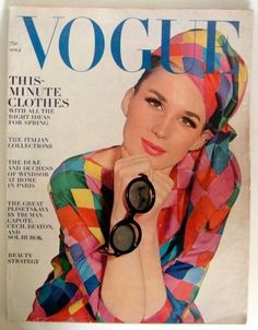 a magazine cover with a woman in colorful clothing on the cover and her hand resting on her face