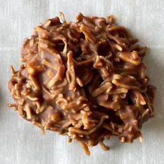 a pile of chocolate covered cookies sitting on top of a table