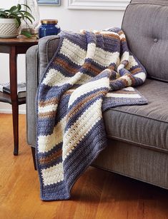 a couch with a blanket on top of it